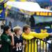 Young fans watch at the Michigan football buses pull up to the stadium at Michigan Stadium on Saturday, September 7, 2013. Melanie Maxwell | AnnArbor.com